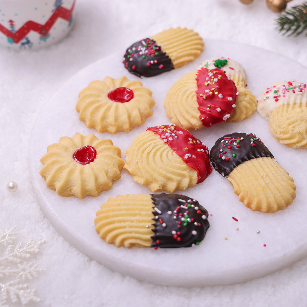 Assorted Christmas Butter Cookies (Danish style) featuring jam-filled, red-dipped, and chocolate-dipped cookies with festive sprinkles.