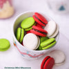 Colorful Christmas mini macarons in a small bowl 
