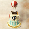 This Red and White Hot Air Balloon Cake features a stunning red and white striped hot air balloon perched majestically atop. 