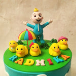 He stands surrounded by a merry band of little yellow ducks, each with its own unique charm and personality. They frolic near a colourful umbrella on this birthday cake for kids, symbolising the joy and protection that friendship brings.