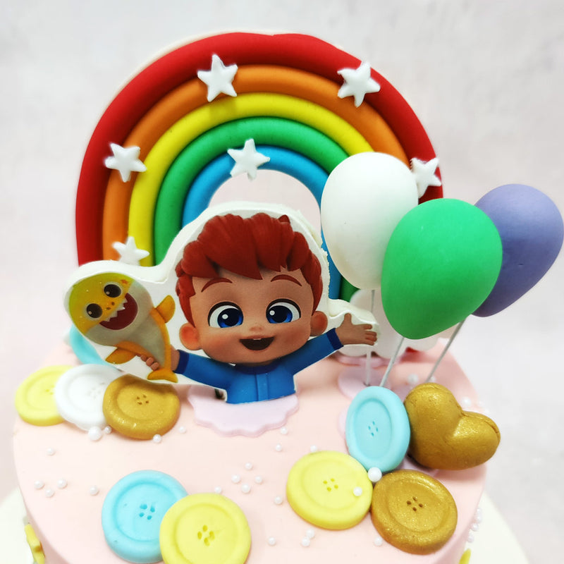 Each sugar art element on this Cocomelon Rainbow Cake design has been meticulously crafted to bring JJ's world to life, from the floating balloons to the fluffy white clouds reminiscent of the show's cheerful outdoor scenes.