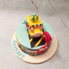 The base of this Cocomelon Yellow Bus cake is adorned in a serene sky blue shade and you will be transported to a bustling street where familiar yellow vehicles make their way through. 