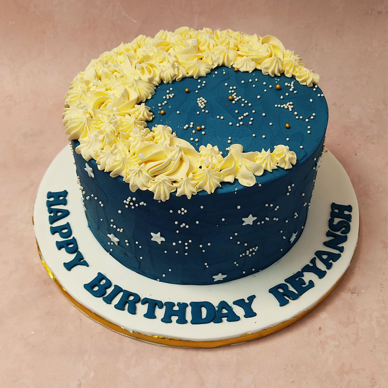 Imagine a star moon theme cake with a base as dark as the night sky, adorned with shimmering silver sprinkles that resembled stardust. 