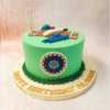 Atop this Cricket Pitch Cake, you'll find a replica of a cricket bat, ball, helmet, and stumps, arranged in a charming mini-cricket scene that will surely captivate any cricket lover.