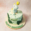 This Dino and Balloon Cake is decorated with dark green to white ombre dots, creating a playful yet elegant background. 