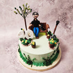This extraordinary dad in garden cake design features a light green base adorned with meticulously crafted buttercream grass, plants, and flowers, creating a vibrant and enchanting scene that will captivate the senses.