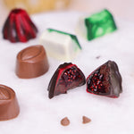 Dark chocolate bonbon with bright red raspberry filling