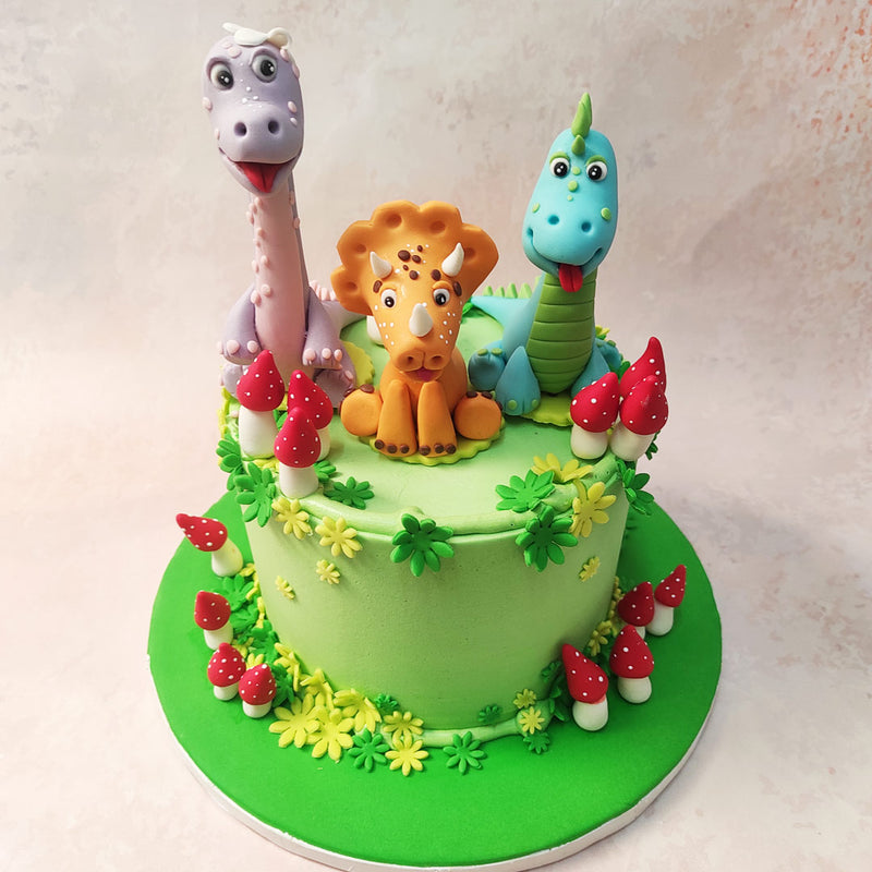 As you journey through the lush landscape depicted on this Dino Cake, you'll find yourself immersed in the enchanting world of Littlefoot, Cera, Ducky, and their dinosaur friends.