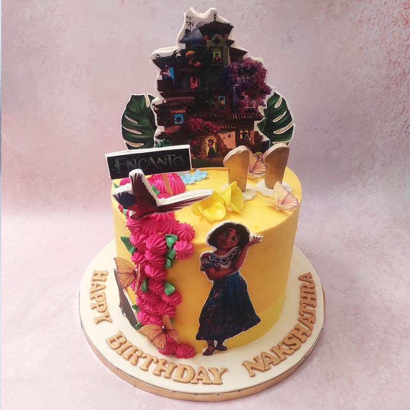As you take a closer look at the Mirabel Encanto cake design, you'll be amazed by the attention to detail in the edible print-outs. Mirabel, with her flowing brown hair and vibrant dress, stands proudly on this Disney Cake, ready to embark on another exciting adventure.