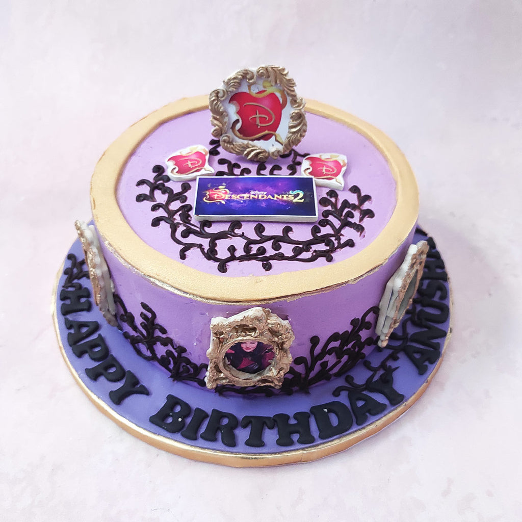 A similar frame with the Disney logo is embedded into the top of this Disney Descendants cake with poster-like logos strewn around it. 