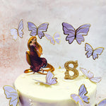 Adorning the top of this Disney Princess Cake is a charming figure of the spirited princess herself, her iconic golden locks flowing gracefully, dressed in her signature purple gown that captures her royal essence. 