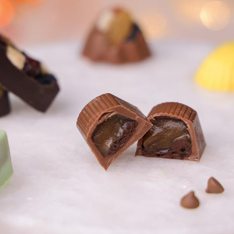 Diwali milk chocolate bonbon  revealing a rich, gooey caramel filling