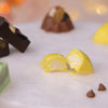 Diwali yellow chocolate bonbon with creamy pineapple coconut filling