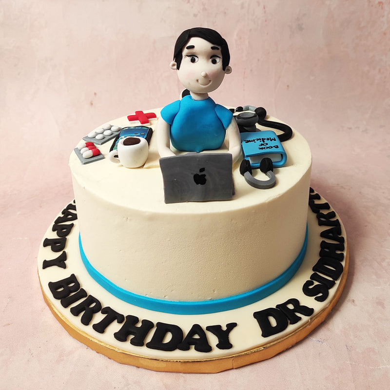 Perfect for the medical practitioner you know and love, on top of this doctor theme cake, you'll find a figurine of a doctor engrossed in his work at his desk. 