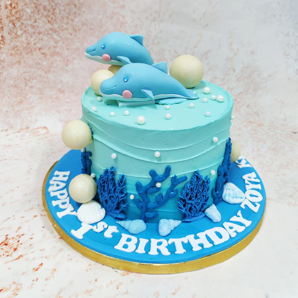 This enchanting Dolphin Theme Cake transports one to the magical depths of the ocean with its captivating design and delicate details. 