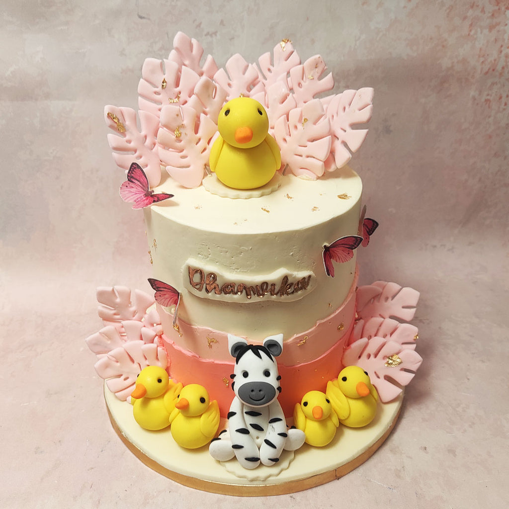 At the zenith of this butterfly fault line cake design, our edible yellow duck takes centre stage, a charming metaphor for the playful and carefree spirit within us. Leading a parade of four pals at the base, it mirrors the innocent joy of celebrations. 