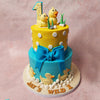 Separating the tiers is an edible blue bow, lending an extra touch of charm to this Blue and Yellow Cake. 