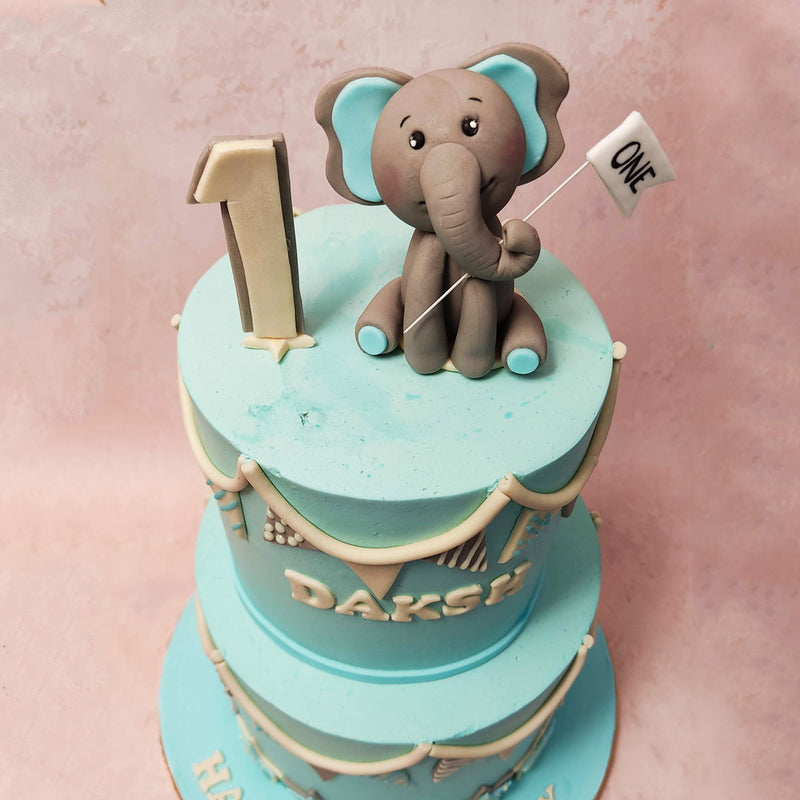 The entire elephant design cake is beautifully adorned with edible banner flags, adding a touch of festivity and joy to any celebration.