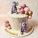 With its meticulously crafted lavender elephants and a cascade of pink and gold balloons, this Elephant and Balloon Cake is sure to bring joy and wonder to your special occasion. 