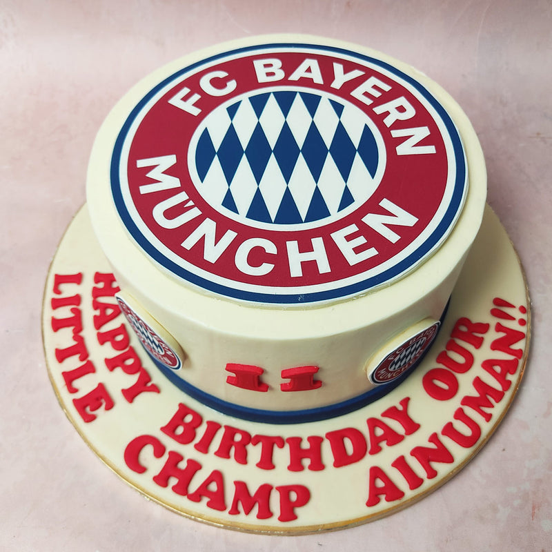 As you glance upon the circumference, miniature versions of the iconic Bayern Munich logo huddle together like a well-coordinated team, creating a fan-tastic display on this FC Bayern Cake. 