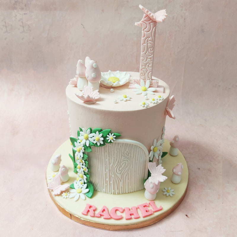 Look closely, and you'll spot dainty pink and white mushrooms, evoking the mysteries of an enchanted forest through this Magical Cottage Cake. 