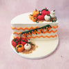 Picture this: red, orange, and white pumpkins and gourds dancing around the circumference of a Half Birthday Cake With Pumpkin Design, creating an autumnal symphony. 