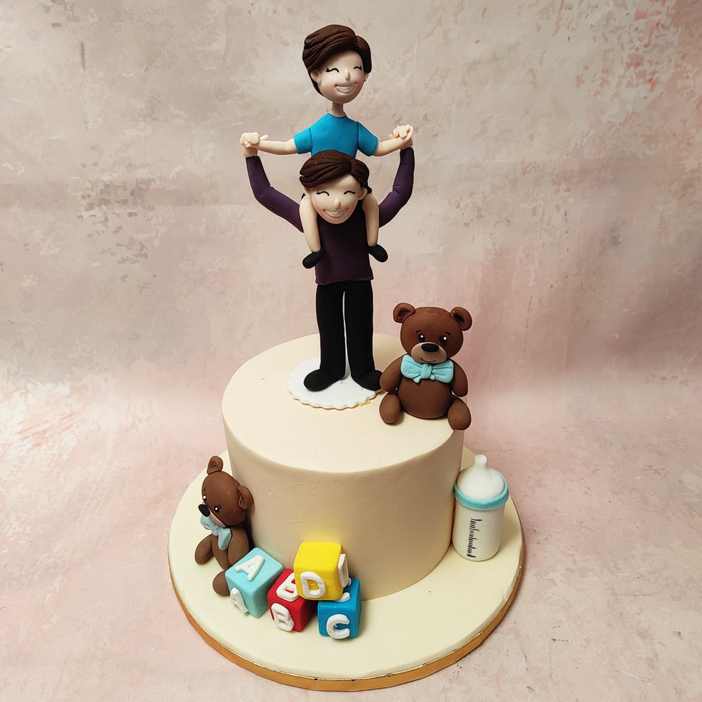 Beside them, a teddy bear, sporting a light blue bow tie adds a touch of sweetness to this Dad and Son Cake