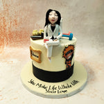 The design features a fondant figure of a woman in a white coat, likely symbolising a professional or scientist, sitting gracefully atop this Favourite Things Cake. 