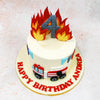 The design of this Fire Theme Cake showcases a meticulously detailed fire engine in classic red and white, complete with a realistic extending ladder and carefully crafted wheels. 