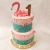 However, the true highlight of this two tier Flamingo Cake With Butterflies is the head of the flamingo positioned on top, cleverly giving the illusion that the entire cake is the body of this majestic bird. 