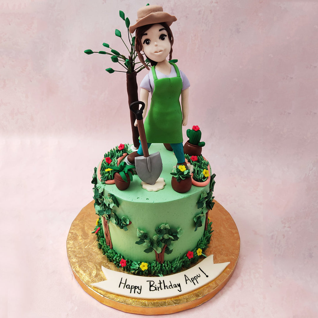 To start off with, the base of this flower garden cake is frosted with a smooth, buttery, light green, Italian Meringue buttercream with dark green, flowering bushes and trees frosted all over, adding a rustic and natural touch to this design, which represents both a place and a feeling.