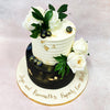 The top tier features a creamy white buttercream with horizontal texture lines, delicately adorned with flecks of gold leaf that catch the light and add a touch of luxury to this Flower Garden Cake. 