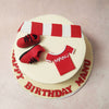 On the crowning glory of this Man U Football Cake, a red and white jersey steals the spotlight. 
