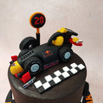 What truly sets this Red Bull F1 cake apart are the meticulously crafted tyre ornaments that adorn it. 