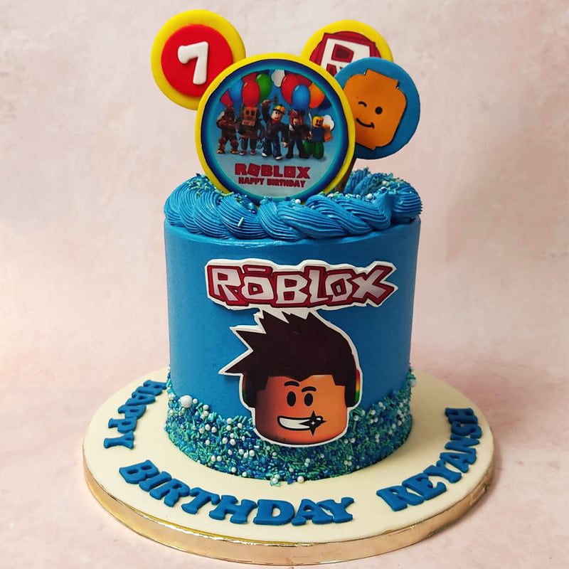 At first glance, you'll be captivated by the vibrant blue hue that covers this gamer cake from top to bottom. 