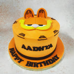 Now, as your eyes wander down, behold the pièce de résistance of this Comic Theme Cake: Garfield himself, grinning mischievously as if he's just raided the fridge again! 