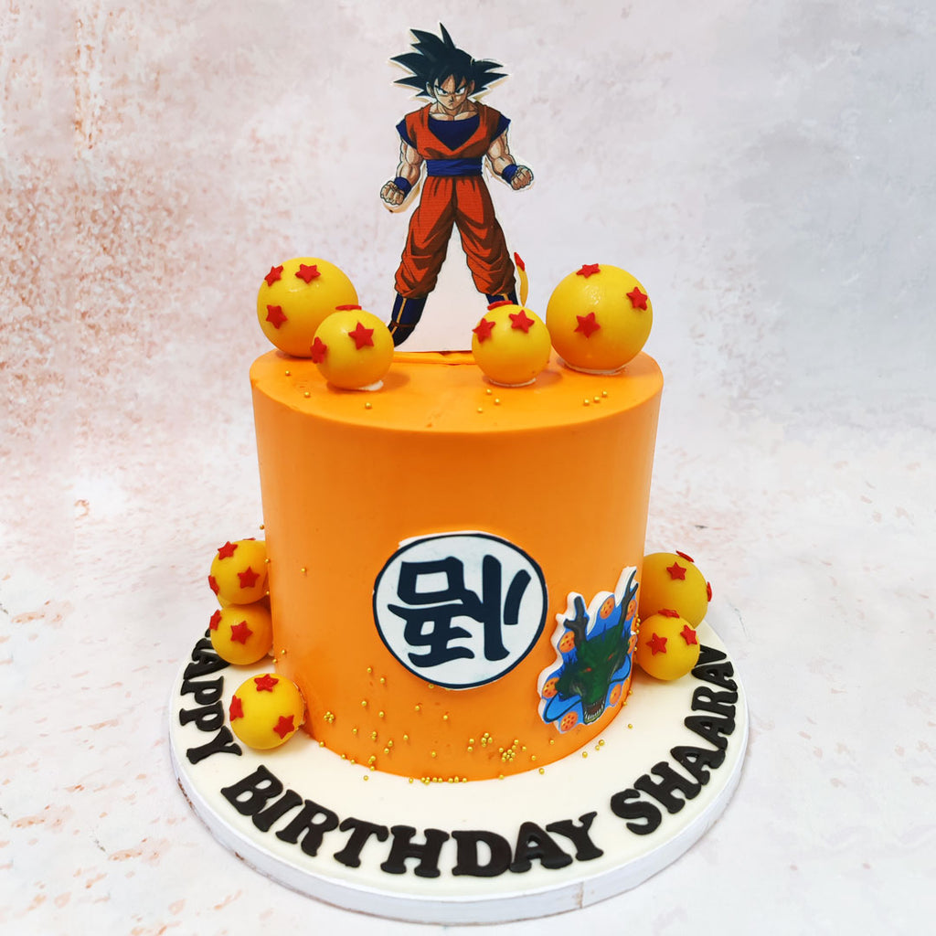 Rising from the summit of this Goku Super Saiyan Cake is a masterfully crafted Goku figurine, poised in his characteristic battle-ready stance, complete with his iconic spiky black hair and classic orange and blue gi uniform. 