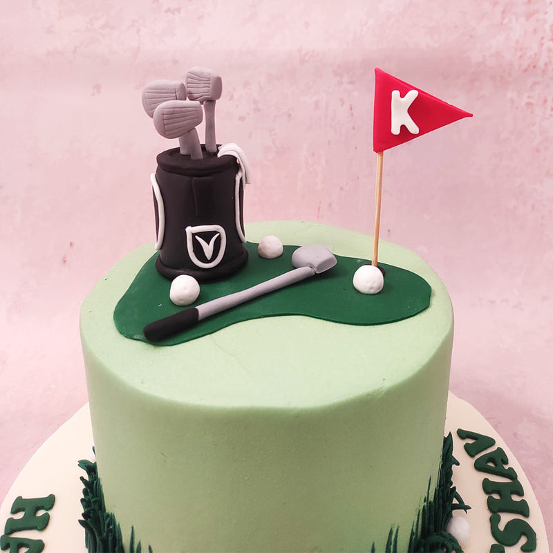 Scattered across the edible landscape of this golf clubs cake are miniature golf balls and flag pins marking each hole. 