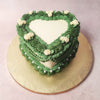 The verdant greenery of the buttercream forms graceful patterns and necklaces around this Vintage Cake, evoking the serenity of a secret garden in full bloom. 