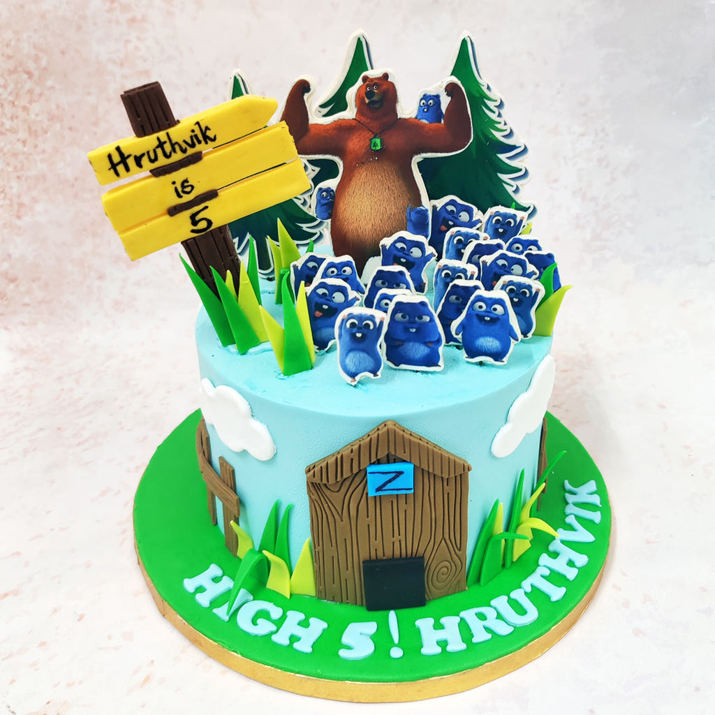 Grizzly, a symbol of strength and leadership, stands proudly amidst a sea of cheerful blue Lemmings, their playful expressions radiating energy and mischief on this Grizzly and The Lemmings Cake. 