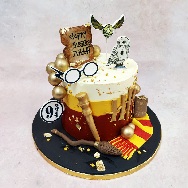  With edible broomsticks, wands, and Gryffindor scarves, this Harry Potter Themed Birthday Cake brings Hogwarts straight to your party table — no spellwork required.