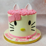 Featuring a simplistic, artistic, minimalistic and realistic aesthetic, this Hello Kitty birthday cake for kids features a tall, white base with Hello Kitty's iconic how featured near her ears and on the ribbon at the base. 