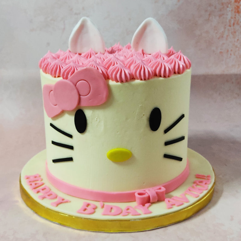 Featuring a simplistic, artistic, minimalistic and realistic aesthetic, this Hello Kitty birthday cake for kids features a tall, white base with Hello Kitty's iconic how featured near her ears and on the ribbon at the base. 