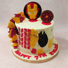 The red and yellow colour palette of this Iron  Man face cake bleeds into the ornamentation, with edible yellow and red shards of fondant embellishing on entire side of this Iron Man cake design and red pairs of diamond embroidery at the centre near abstract smudges of red and yellow patterns, complemented with black.