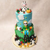 Both tiers of this two tier Shaun The Sheep cake are beautifully embellished with adorable sheep, colourful flowers, playful chickens, and plump pumpkins