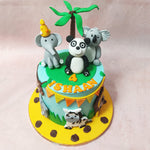 On the playful canvas of this Koala Cake, meet figurines of a Panda and an Elephant, all adorned in party hats, joining the celebration. 