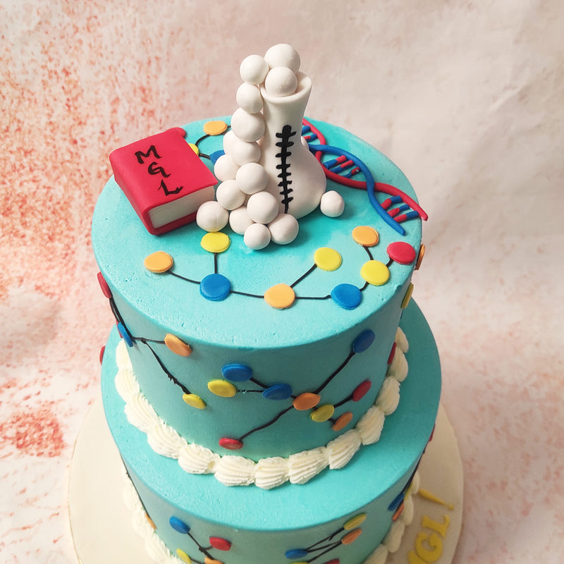 Adorning this Laboratory Cake are colourful, molecular-like patterns that dance around each tier, symbolising the intricate beauty of scientific exploration. 