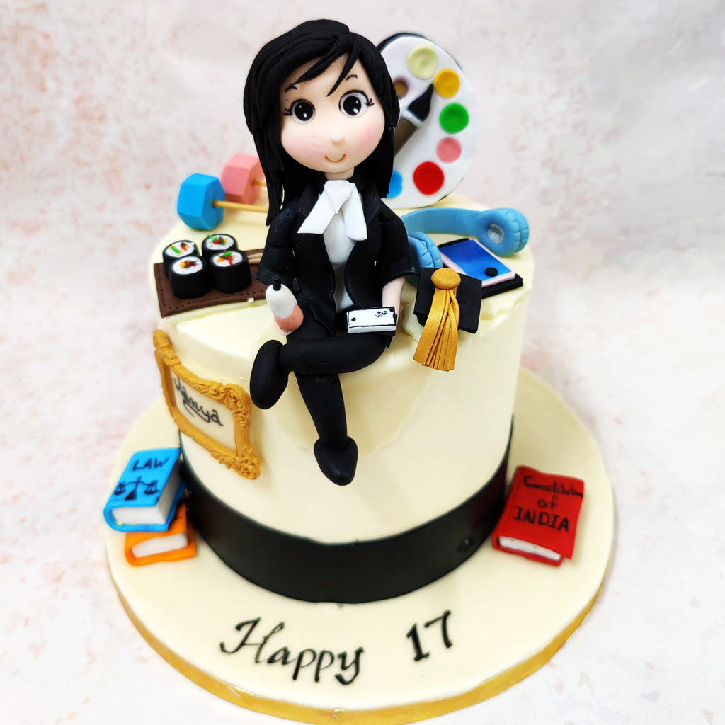 From the miniature sushi rolls representing culinary passion to the artist's palette displaying vibrant colours of creativity, each detail on this Lawyer Theme Cake has been thoughtfully crafted.
