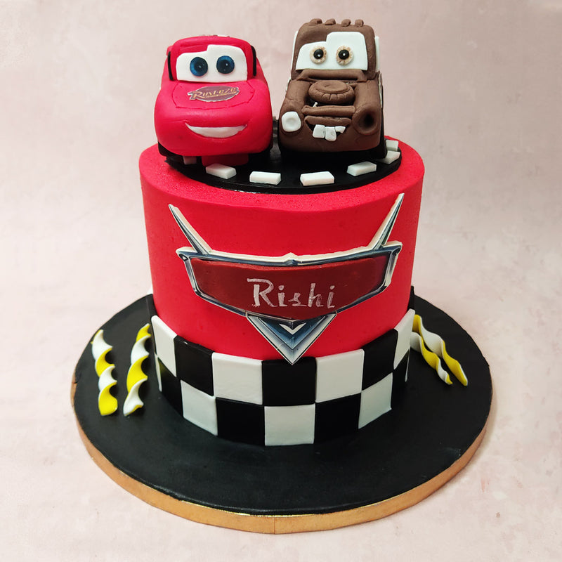 With its vibrant red base, adorned with a chequered flag wrapped around the bottom, this Cars movie cake is a true symbol of speed, victory, and friendship.