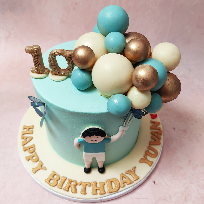 Graceful blue butterflies adorn this Balloon Theme Cake, adding to its serene and elegant charm, perfect for celebrating special moments with your little prince.